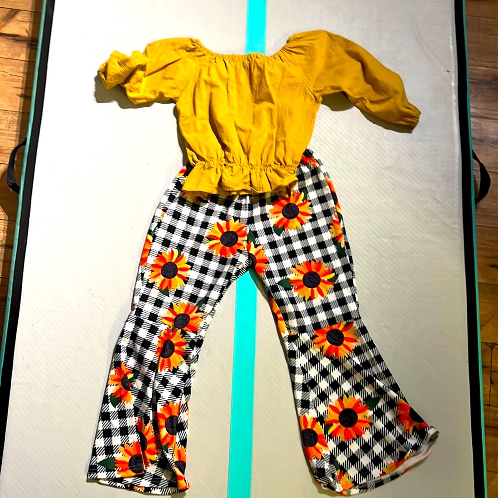 Bell bottom pants and a long sleeve dress shirt